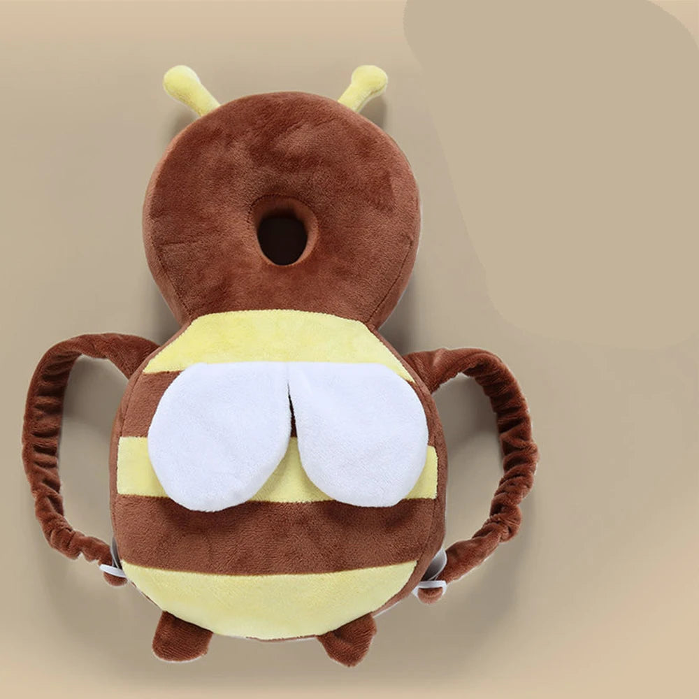 A plush toy of a bee with brown and yellow stripes, featuring large white eye patches.