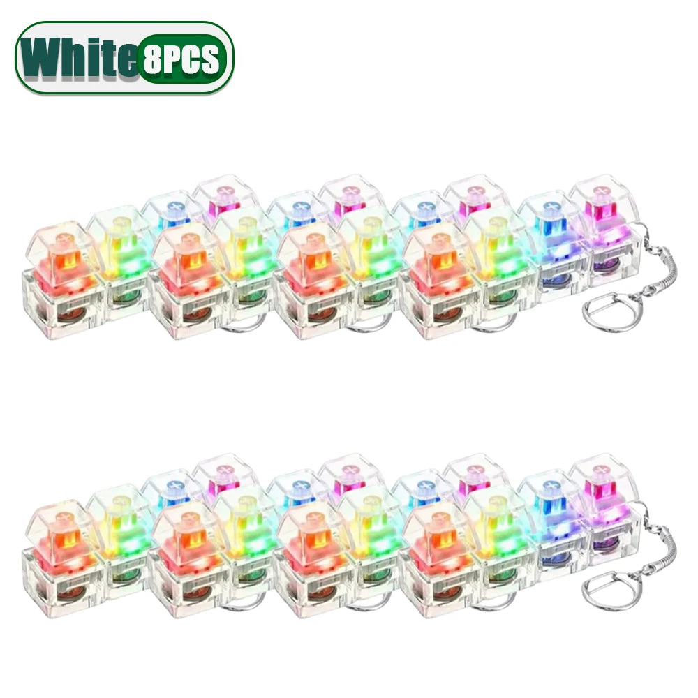 Eight pieces of colorful LED clickable fidget keychains with a keyboard design