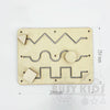 A wooden busy board with various interlocking puzzle pieces and components for fine motor skill development.