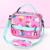 A pink insulated lunch bag with a light blue strap featuring a princess and fairy theme.