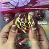 Hands hold a brown and yellow squishy stress ball, demonstrating its crispy shell feature.