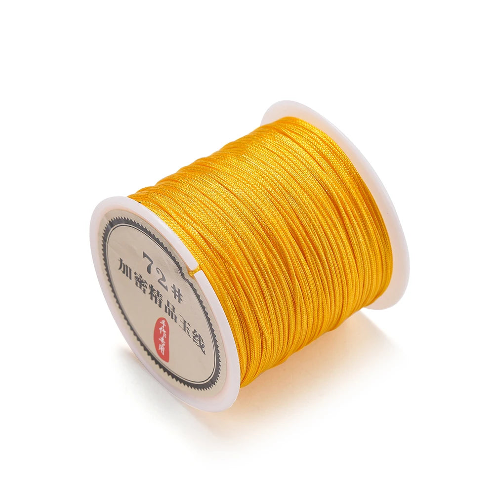 A spool of yellow 0.8mm nylon macramé cord for jewelry making with Chinese text on the label.