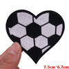 Black heart shaped iron-on patch featuring an embroidered soccer ball design in white and black.