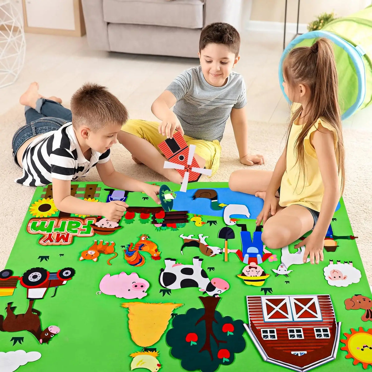 A family is playing with a green felt board featuring various farm animals and objects for learning.