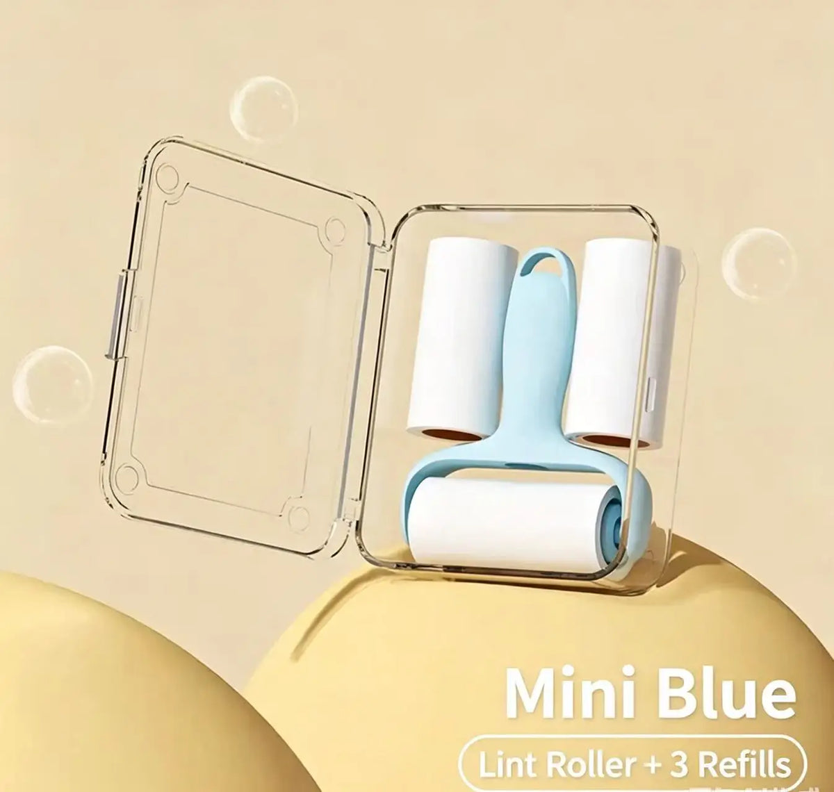Mini Blue lint roller with three refills displayed in a clear plastic case.