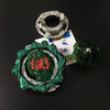 A metal battle spinning top with a green and red design is shown next to its detached spinning mechanism.