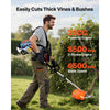 A man is using a gas-powered hedge trimmer to cut thick vines and bushes outdoors.