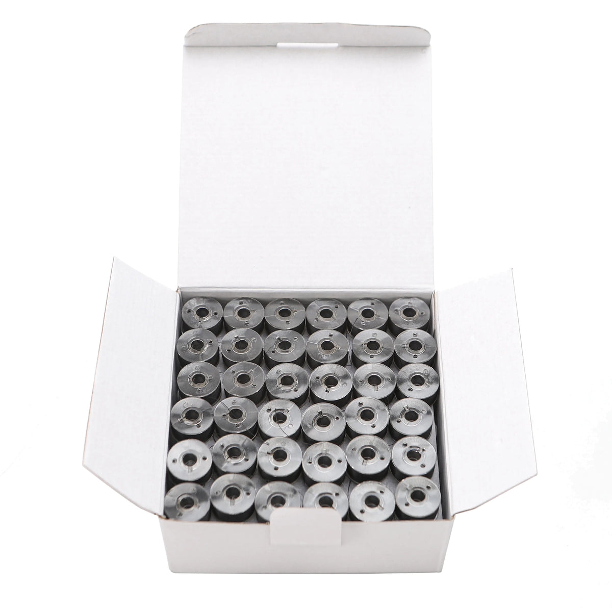 A white box containing numerous Class 15 prewound bobbins with 60wt polyester thread for home embroidery machines