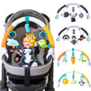 A baby stroller featuring an arch toy with various hanging plush charms and toys.