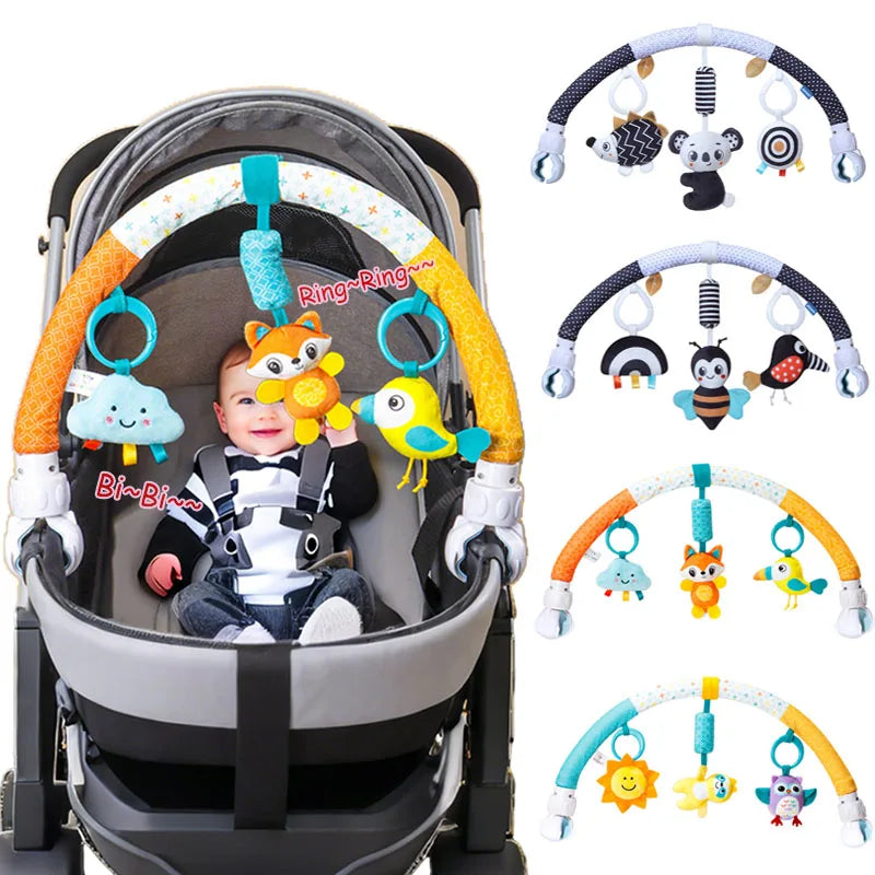 A baby stroller featuring an arch toy with various hanging plush charms and toys.