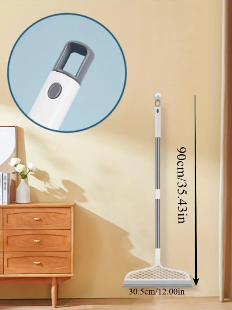 A long, white detachable broom with a silicone scraper head is shown against a light wall.