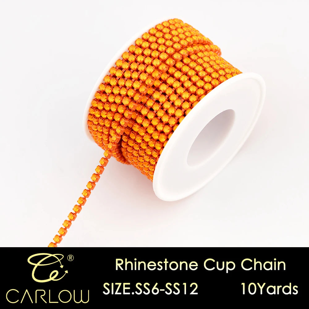 A spool of orange and yellow rhinestone cup chain is shown next to its measuring tool.
