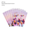 A set of ten pink and purple gift bags featuring anime-style characters for a birthday party decoration kit.
