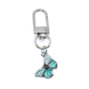 A turquoise butterfly keychain charm with a silver clasp.