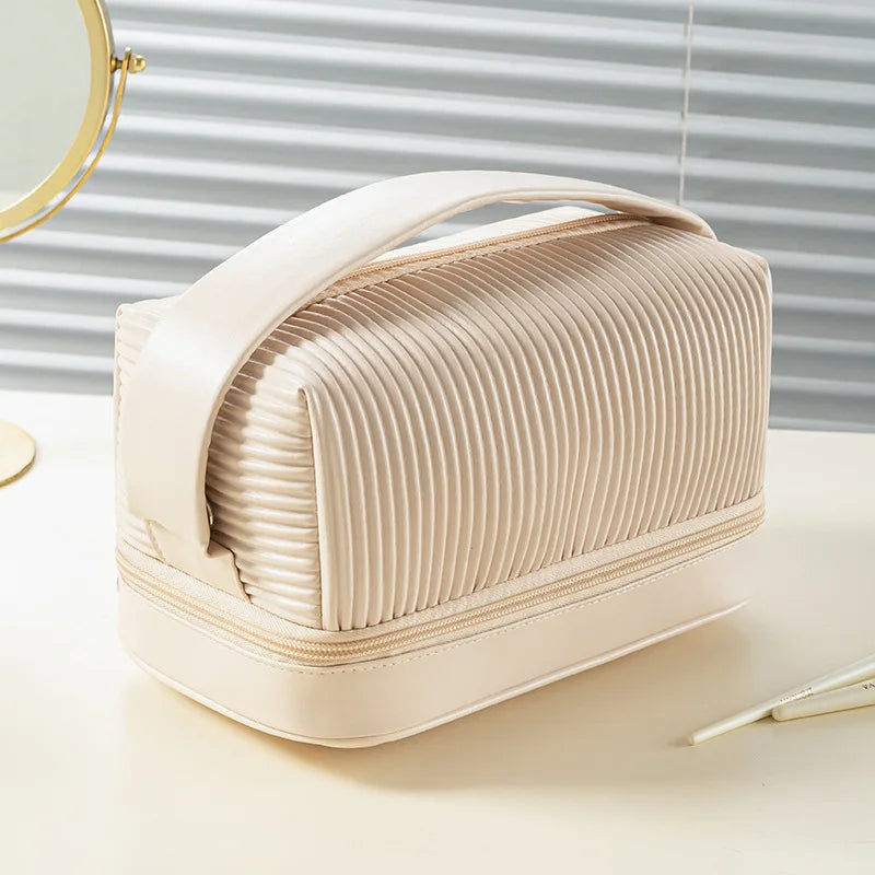 A beige PU leather makeup bag set with a ribbed texture is shown on a white surface.