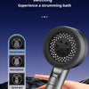 A hand holds a silver shower head with multiple buttons, demonstrating four-gear key switching for a strumming bath.