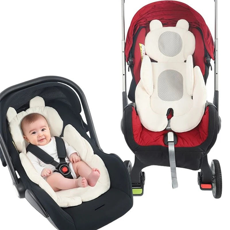 A red and black stroller seat cushion with a white bear-shaped insert is shown on a stroller frame.