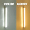 A side-by-side comparison of a white light and a warm white LED night light mounted on a wall.