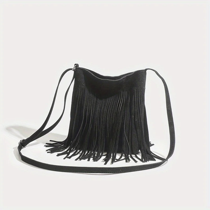 A black bohemian fringe shoulder bag with thin straps is displayed against a white background.