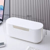 A white cable management box with a slotted opening is shown on a desk, measuring 11cm in length and 12.5cm in height.