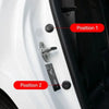 Close-up of a white car door showing two positions for universal anti-collision silicone pads.