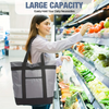 A woman holds a large gray insulated cooler bag while shopping in a grocery store.