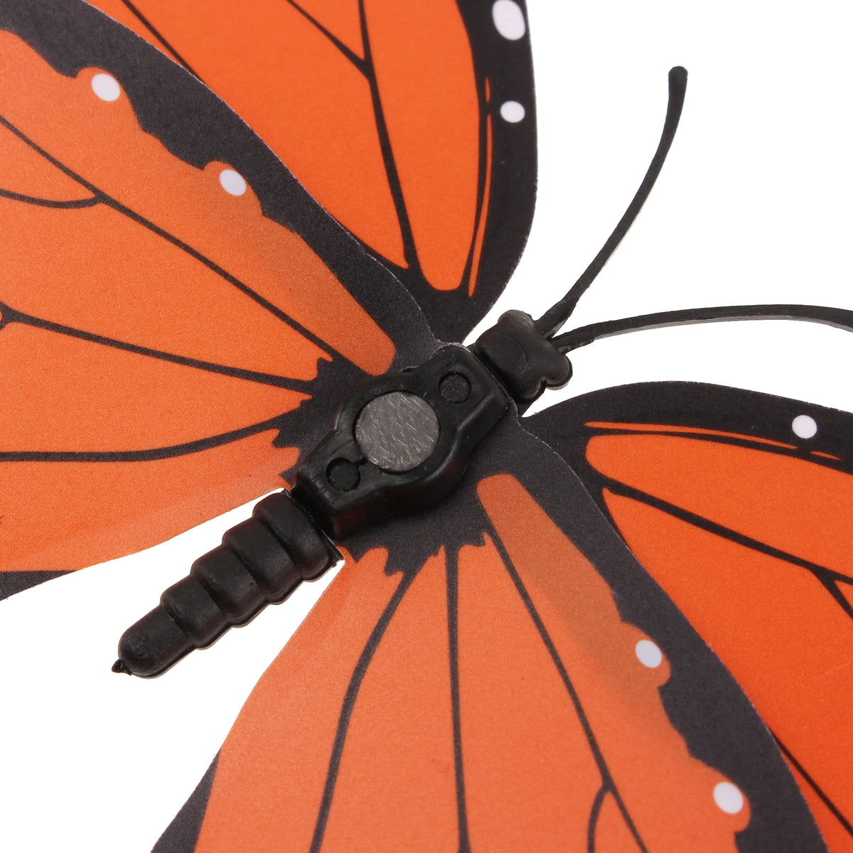 An orange monarch butterfly with black markings and antennae, used as a magnet or adhesive decor.