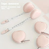 Pink PU leather tape measure shown next to heart-shaped pads for body measurements
