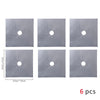 Six square gray silicone mats with circular holes for protecting gas stoves