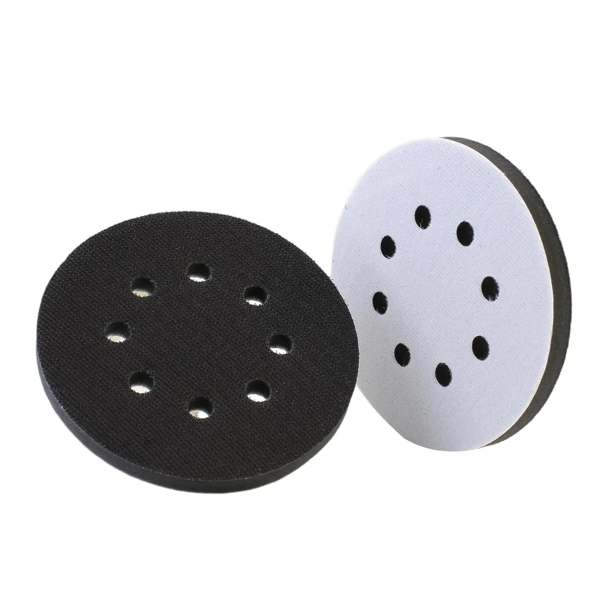 A pair of black and white foam sanding pads for random orbit sanders.