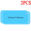 Two pieces of clear anti-fog and rain-repellent car mirror film measuring 340mm by 160mm.