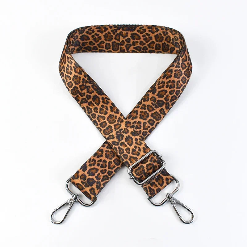A brown leopard print wide adjustable crossbody bag strap.