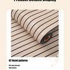 Roll of beige and black striped wallpaper showing a close-up of the pattern detail.
