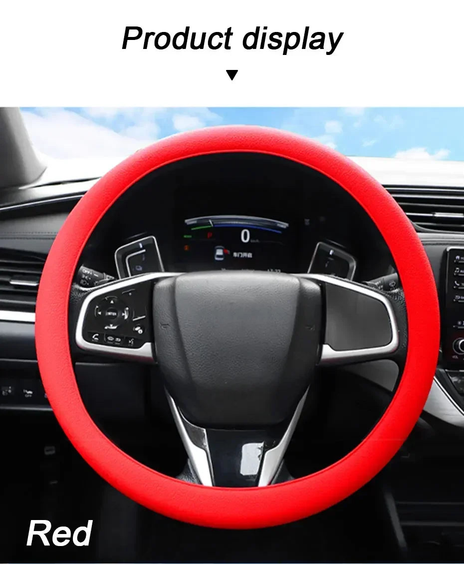 A red silicone steering wheel cover is displayed inside a car's interior, showing the steering wheel and dashboard controls.