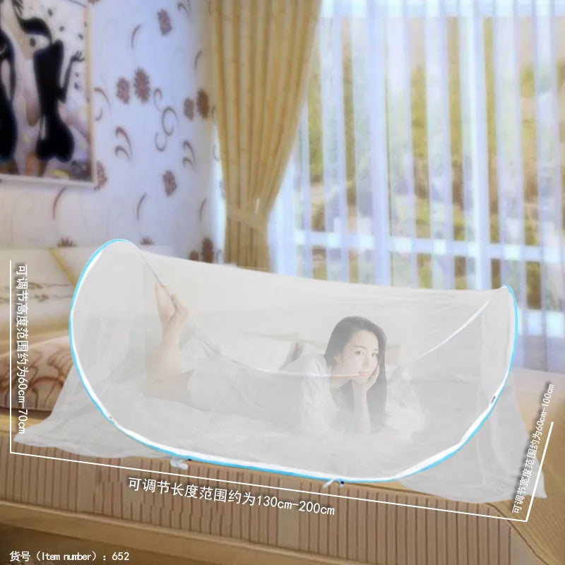A clear instant pop-up mosquito net is shown draped over a bed, demonstrating its size and use for protection.