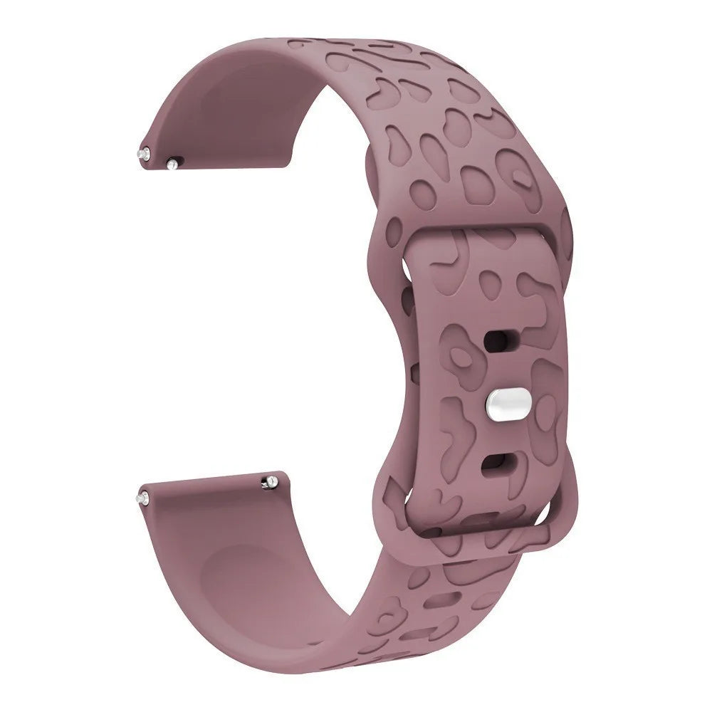 A mauve silicone watch band with an engraved pattern for a Redmi Watch 5.
