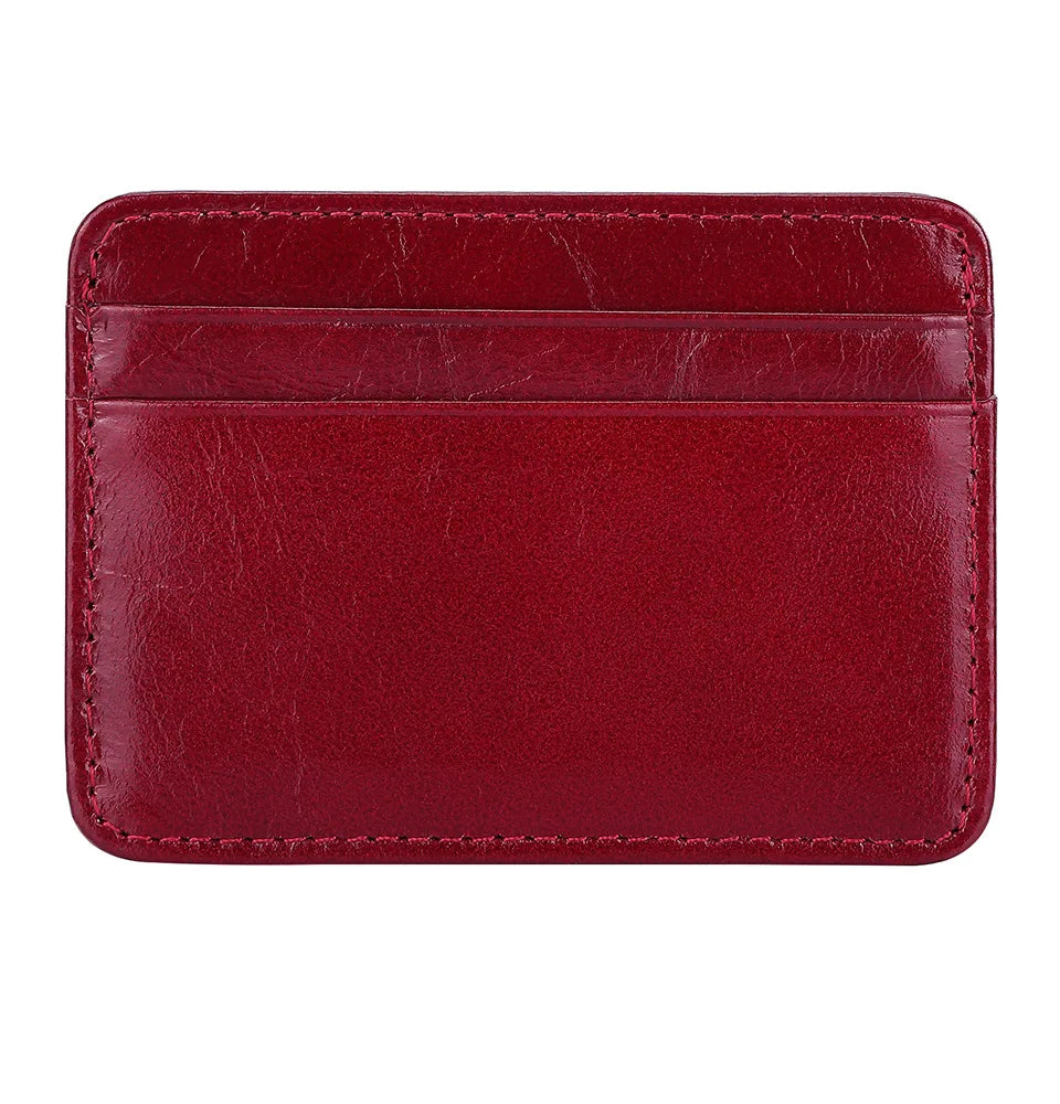 A maroon genuine leather card holder with rounded corners and stitched edges.