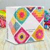 A box of 50 crochet square pattern cards featuring mix and match designs in various bright colors.