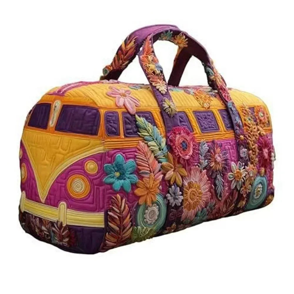 A purple and yellow quilted travel duffle bag featuring colorful floral embroidery and stitching.