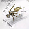 A DIY assembly kit of a metal insect puzzle decor featuring a body, legs, and wings.