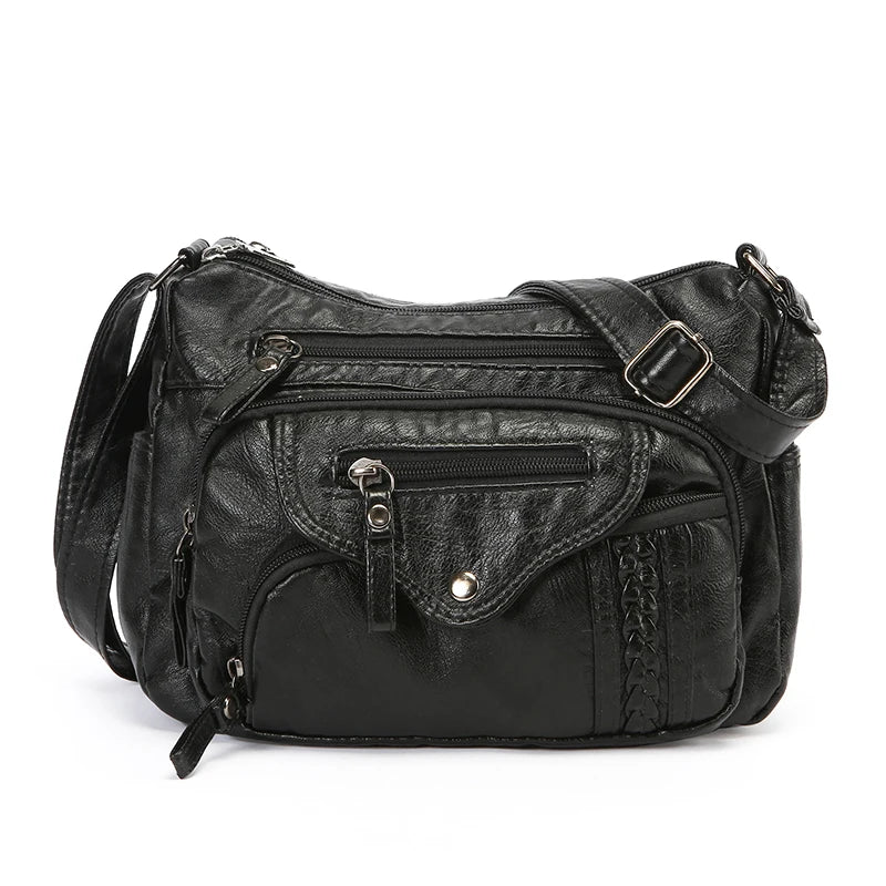 Black classic leather tote bag with adjustable strap shown from the front.
