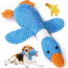 A blue rubber duck toy and a brown and white dog lying down.