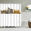 A shower curtain featuring cartoon cats of various colors and expressions.