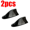 Two black shark fin car antennas for FM/AM signal enhancement