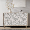 A wooden cabinet featuring a botanical line art wallpaper with gray and white floral designs.