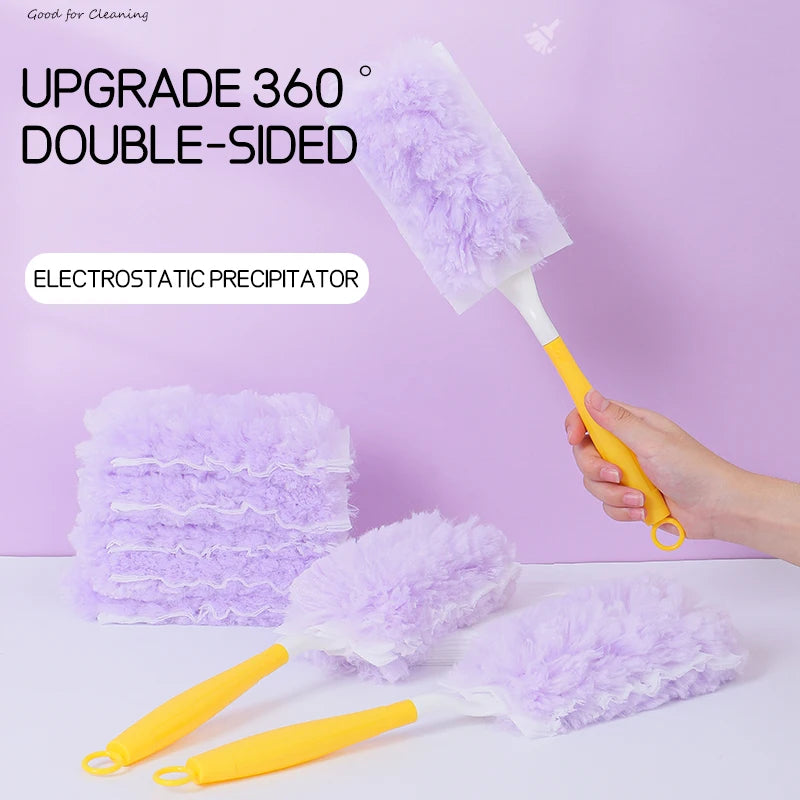 A hand holds a purple electrostatic precipitator double-sided feather duster, showing its fluffy texture and yellow handle.
