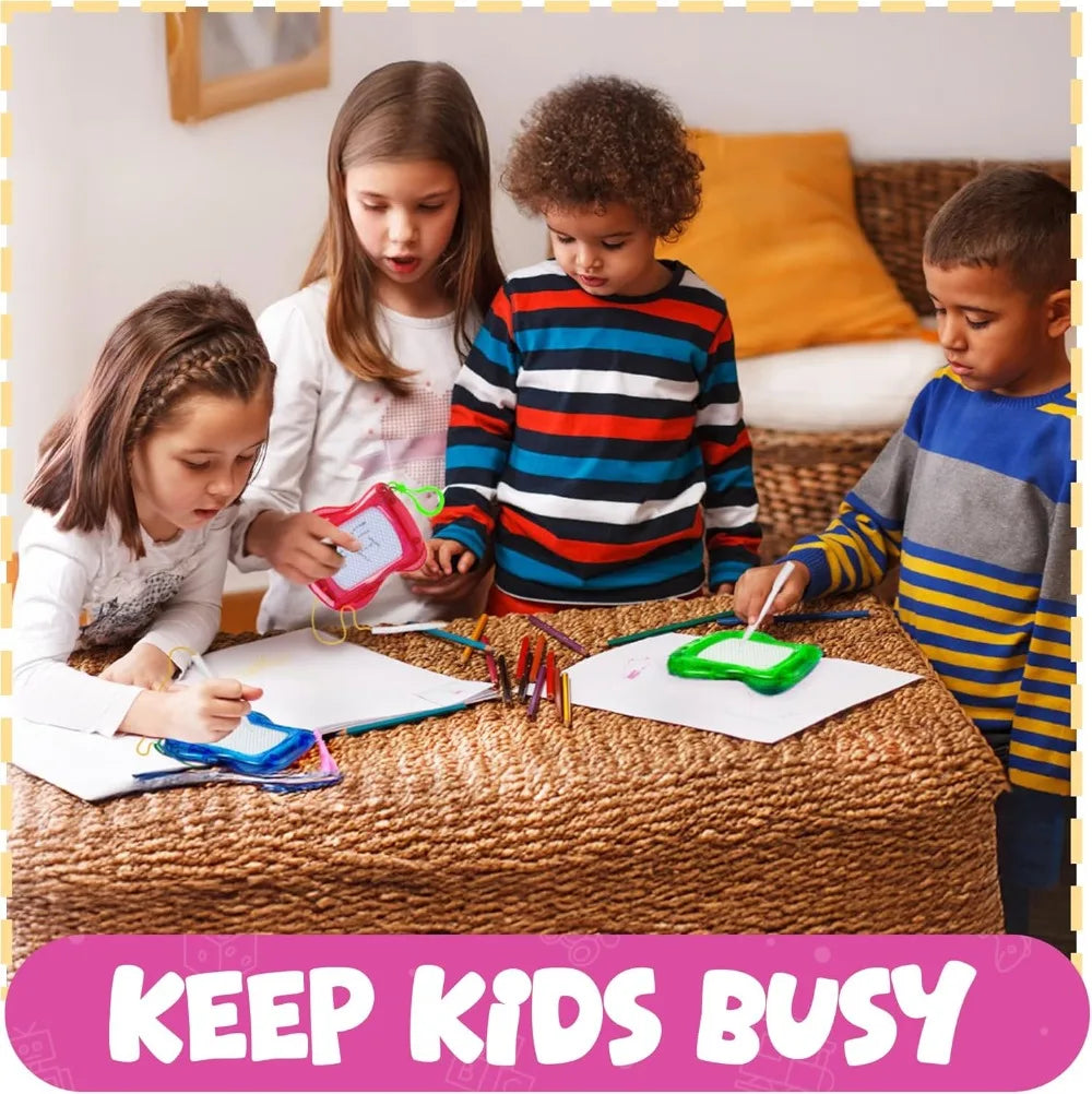 Children are drawing on a magnetic board with colorful tools and paper.