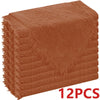 A stack of six rust-colored, raw-edge polyester cloth napkins.