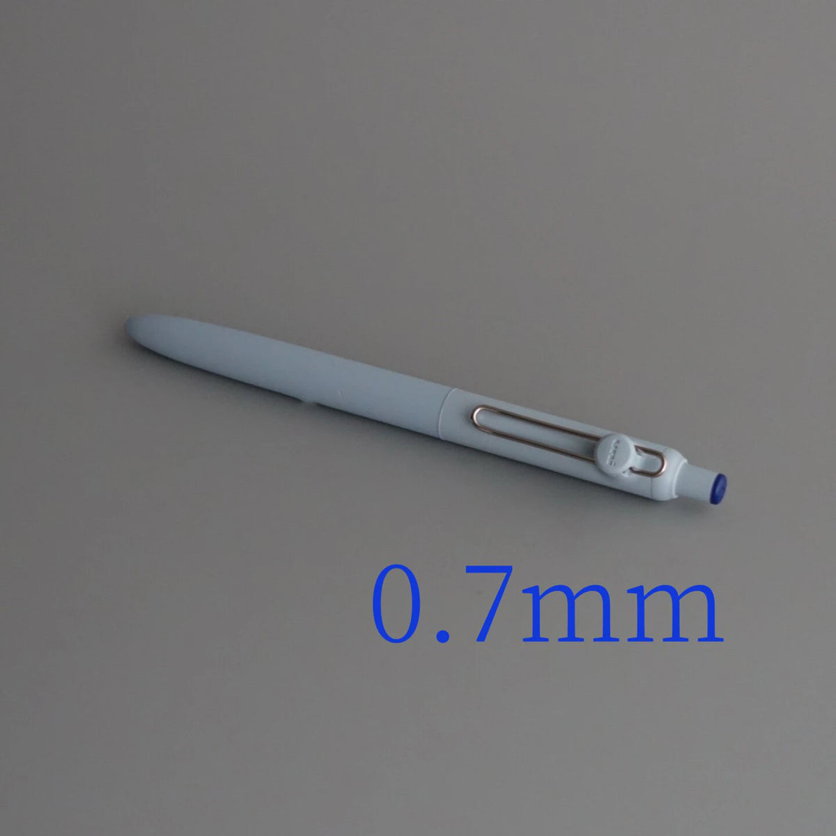 A close-up view of a light gray Uni ZENTO Quick-Dry Gel Pen with a 0.7mm tip.