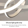 A close-up of a white silicone light guide strip fixture mounted on a ceiling.